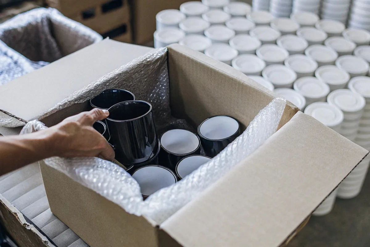 Ensuring Insurance Claim Approval Documenting damaged enamel mugs with photos and packaging to ensure insurance claim approval (ID#4)